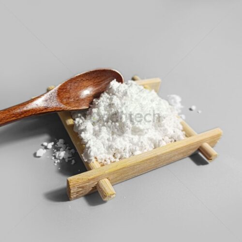 SODIUM SULFATE powder posed in a wooden tray.
